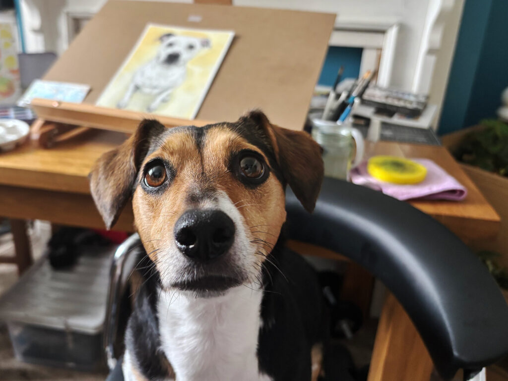 Maggie beside the drawing table in the Shimmus Studios workspace.